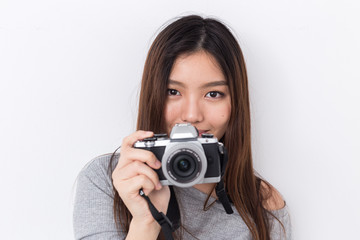 Young asian girl with camera