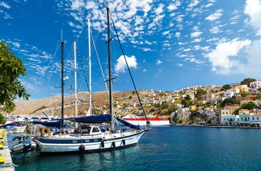 Peel and stick wall murals City on the water Boats in the harbor of Symi Island. Greece, Europe