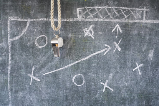 whistle of soccer or football referee on a black board,  tactics