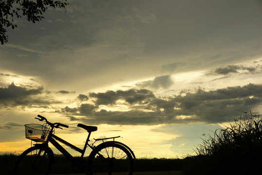 bicycle sillouette at sunset nature background