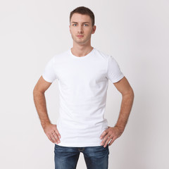 t-shirt design and people concept - close up of young man in blank white t-shirt. Clean shirt mock up for design