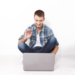 Young couple talking to each other via online video chat.