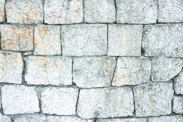 Masonry stone arbitrary shape. Fragmented stone wall texture. Closeup of stone wall use for construction business and designers