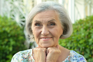 senior woman in summer park