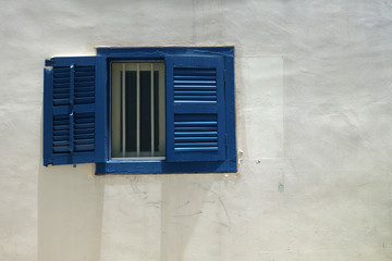 Fototapeta na wymiar Isolated blue window with white wall