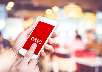 Hand holding mobile  with order button and empty screen for addi
