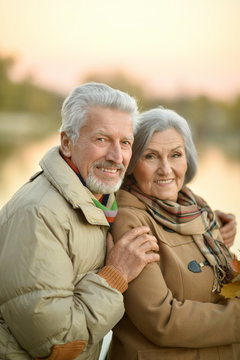 Happy senior couple  near river