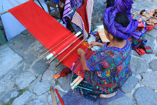 Mayan Woman Working With A Loom In Guatemala