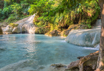Jangle landscape with flowing turquoise water of seven step Eraw