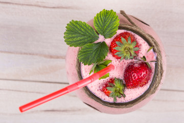 strawberry milkshake on a rustic table, strawberry yogurt, berry dessert drink