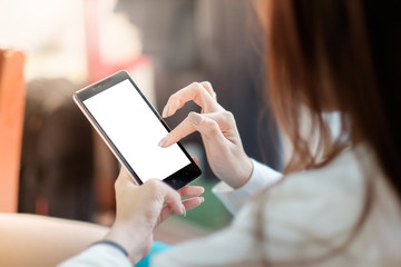 Asian business woman holding and using smart phone with white blank empty screen.