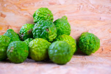Bergamots on wooden background, selective focus