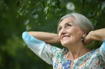 Senior woman in summer park