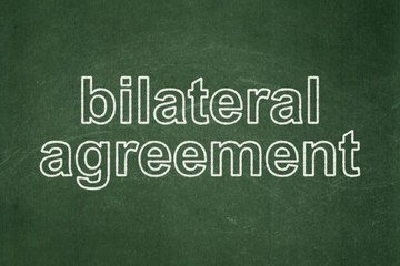 Obraz premium Insurance concept: Bilateral Agreement on chalkboard background