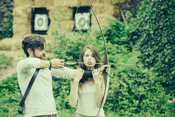 Attractive couple shoots out of the bow