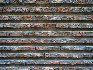 Red old worn brick wall texture background.