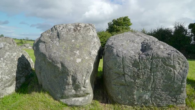 The big stones on the green pasture in the county of Carrowmore in Ireland