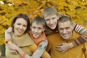 Fototapeta premium Happy family in autumn forest