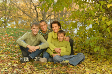 Fototapeta premium Happy family in autumn forest