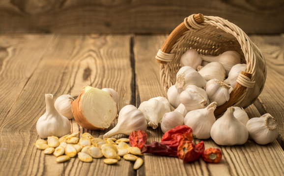 garlic in a basket on a wooden table