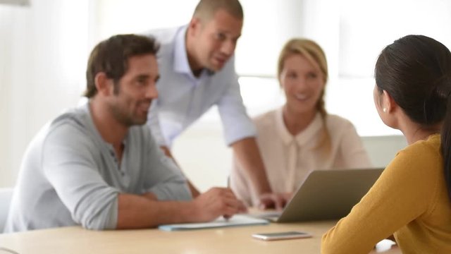 Portrait of smiling woman attending work meeting