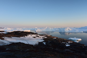 icebergs are melting at arctic ocean in Greenland. Climate change.