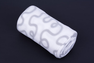 Warm winter wool blanket on dark background