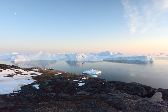 icebergs are melting at arctic ocean in Greenland. Climate change.