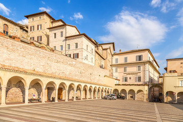 Fototapeta na wymiar Assisi, Italy. Urban landscape with a portico (XV cent.)