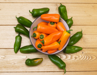 Colorful bell pepper on a wooden table.
