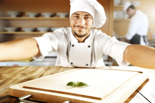 cook chef making selfie and wooden top place 
