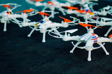 Drones squadron toy on a wooden floor. Preparing for drone on the floor for drone competition.