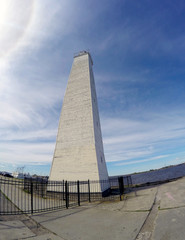 Obraz premium Kronstadt promenade to the pier with a lighthouse and ships. St. Petersburg.Russia...