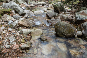 Fototapeta na wymiar Water Stream flowing in the mountain