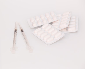 Medicine pills and syringe 