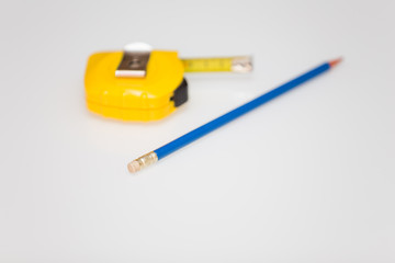 Meter stick and pencil / background