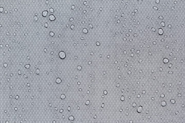 Water drops on a light gray background. Abstract background.