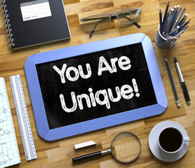 You Are Unique Concept on Small Chalkboard. 3D. © tashatuvango