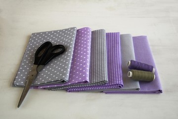 Set of sewing, gray and purple style, sewing accessories, background