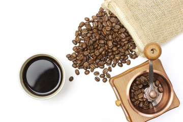 Hot coffee black coffee and coffee beans grinder in white background
