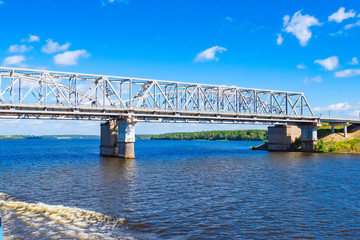 Railway bridge over the river on a concrete base