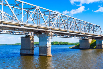 Railway bridge over the river on a concrete base