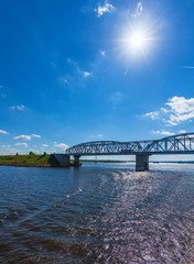 Obraz premium Railway bridge over the river on a concrete base