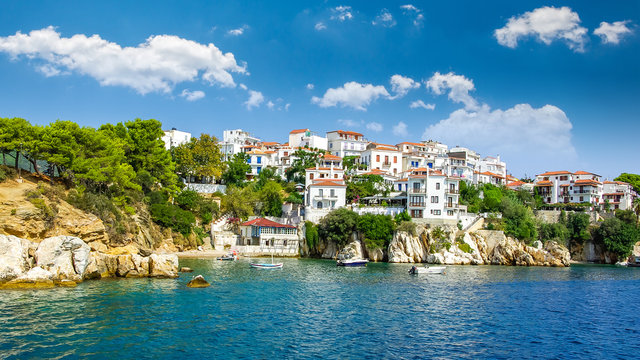Skiathos town on Skiathos Island, Greece. Beautiful view of the old town with boats in the harbor.