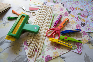 hand made scrap-booking post card and tools lying on a table