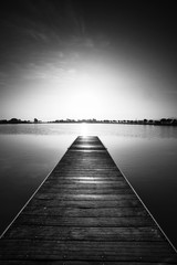 Black and white photography, pier at sunrise in a park of Manresa,Catalonia, Spain. Nice walking area with trees and water pond - 122786227