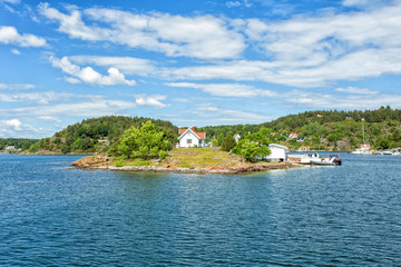 White small finnish wooden sauna log cabin on island