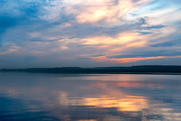 Fototapeta na wymiar summer sunset on the shore of a lake