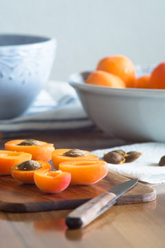 Halfs of apricots on cutting board. Selective focus.