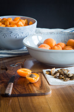 Halfs of apricots on cutting board. Selective focus.